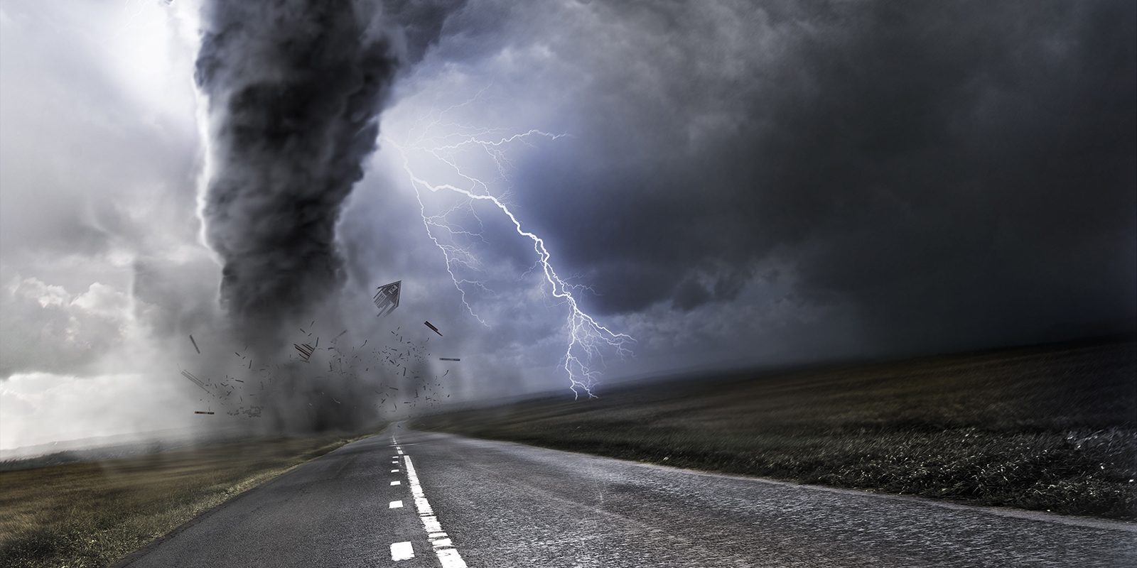 Powerful Tornado - destroying property with lightning in the background